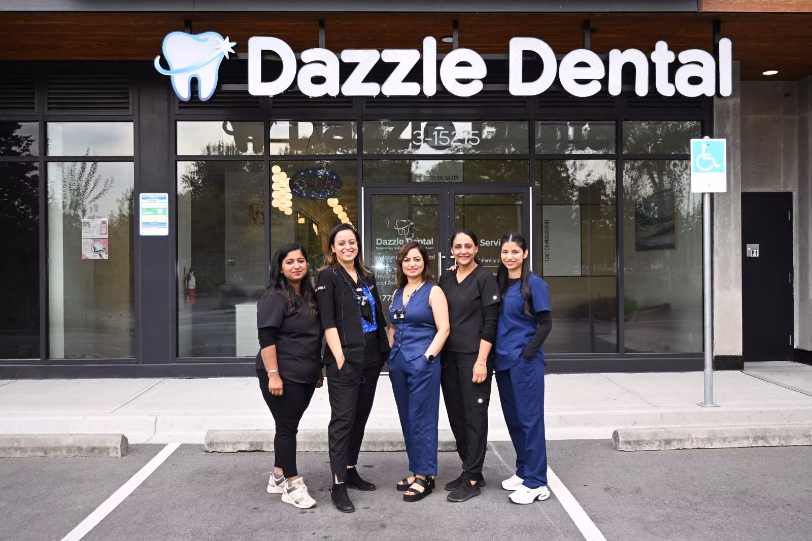 The Dazzle Dental team standing together outside the clinic